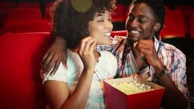 Cute couple watching a movie