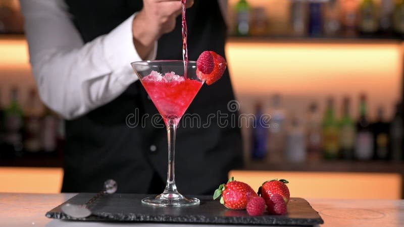 Expert barman is making cocktail at night club. stock video